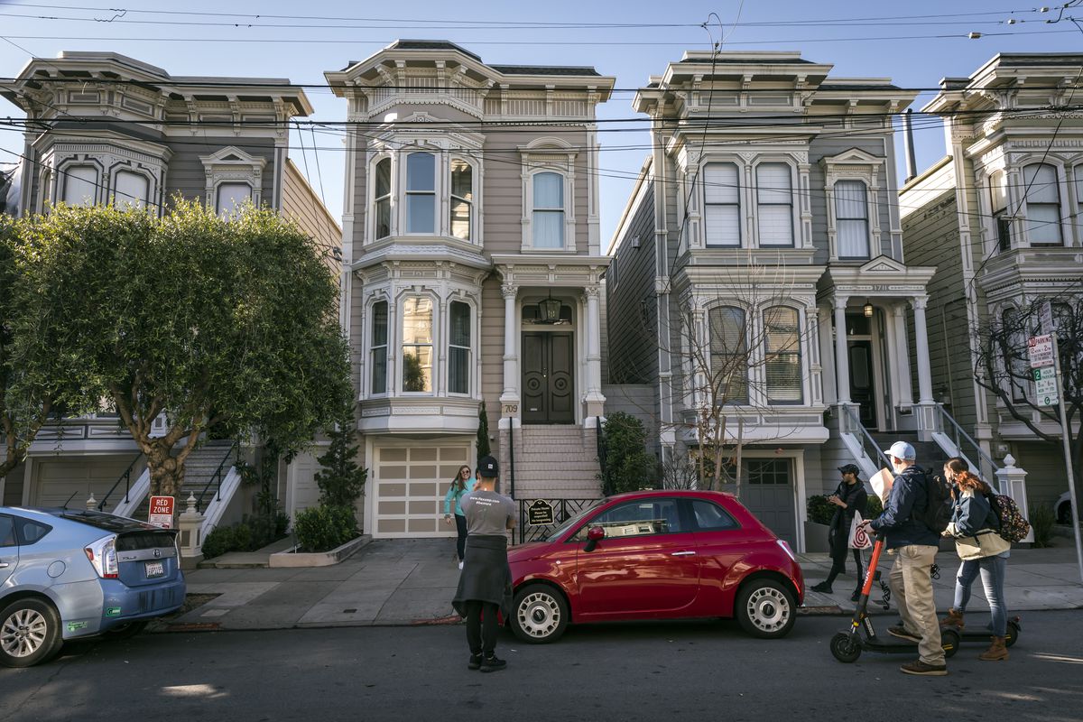A photo of three signature Stick-style houses in San Francisco. 