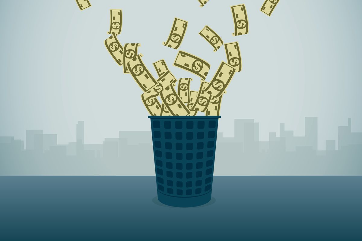 An illustration of money flying out of a trash can.