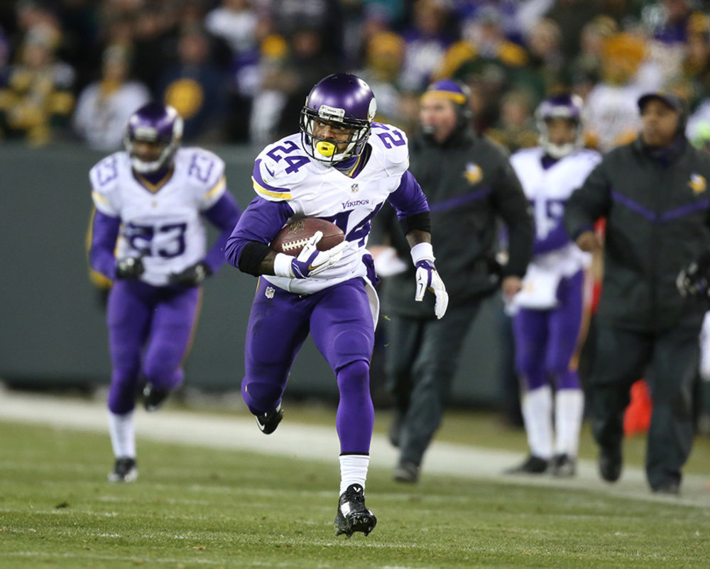 Captain Munnerlyn returned a fumble for a touchdown and Xavier Rhodes made a key interception in the second half of Sunday's game in Green Bay.