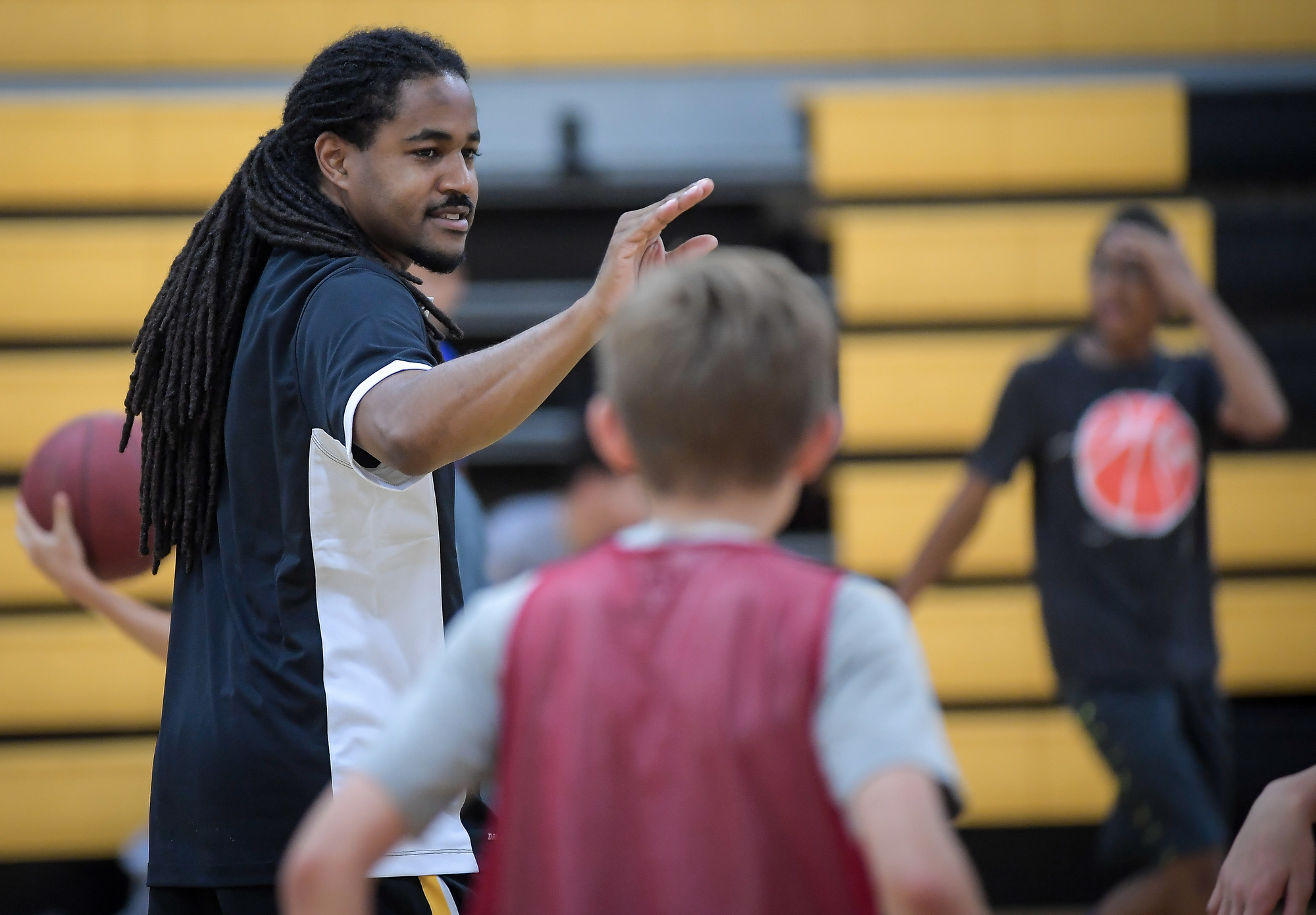 Delasalle head coach Travis Bledsoe gestured to kids taking part in a basketball camp at Delasalle High School Thursday. ] AARON LAVINSKY ï aaron.lav