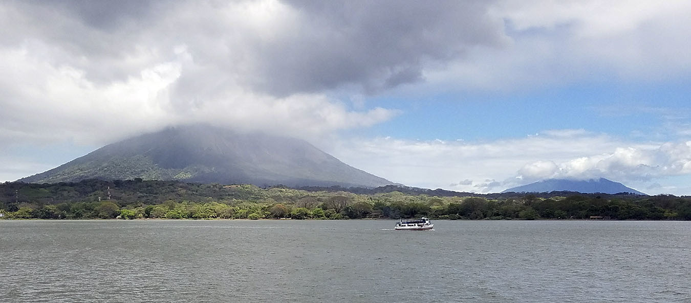 The volcanos Concepcion (left) and Maderas, which form the island of Ometepe, can be seen from the passenger ferry to the island in Lake Nicaragua.