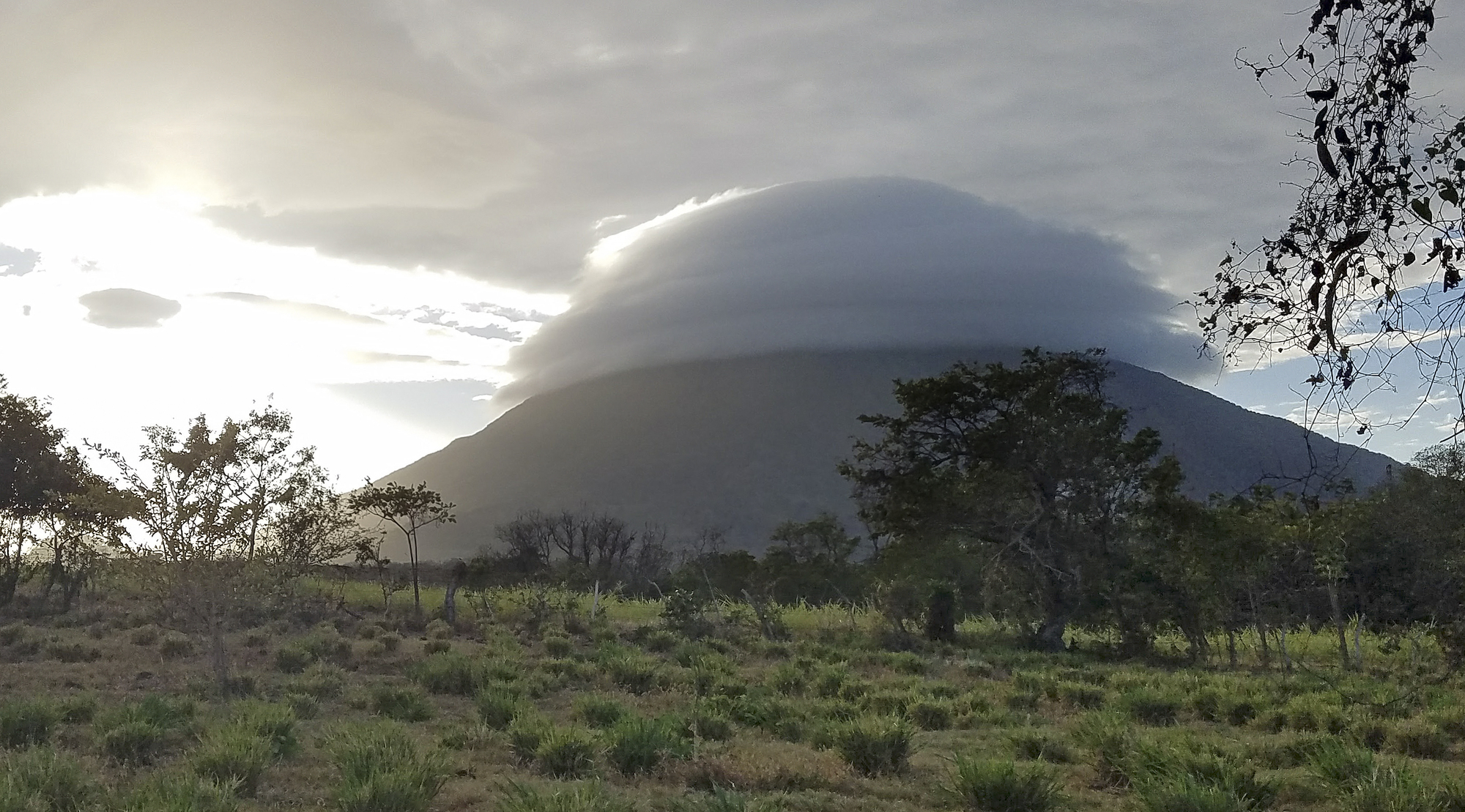A dome of clouds forms over the active volcano Concepcion at sunset on the island of Ometepe in Nicaragua.
