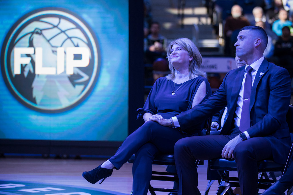 Flip Saunders' wife, Debbie, and his son Ryan share a moment during a pregame ceremony honoring the former Wolves coach and executive. A permanent ban