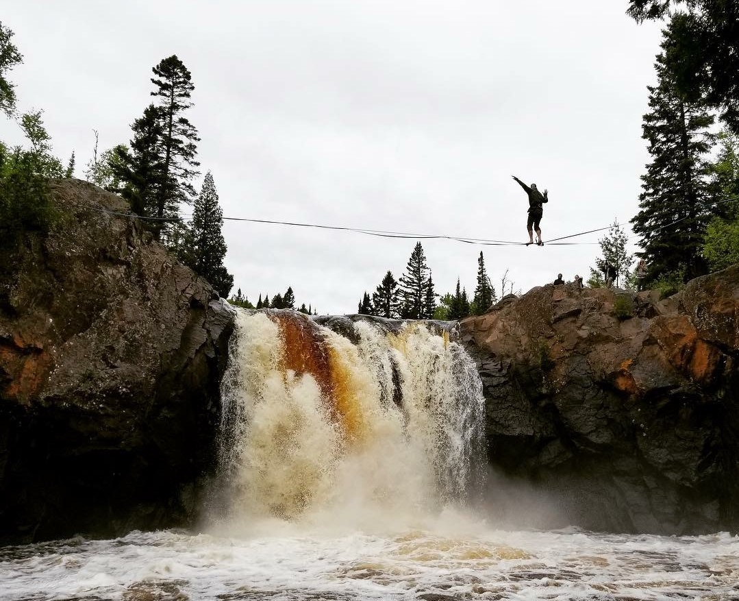 Mark McKee on a slackline over a waterfall near Finland, Minn.