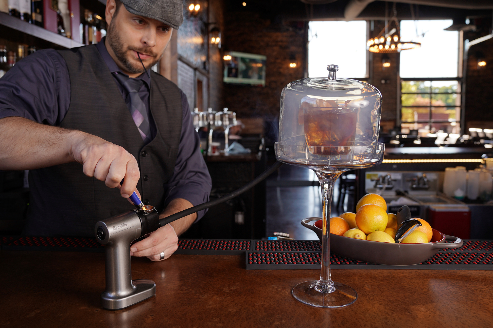 Brick & Bourbon owner Gary Sivyer used a smoking gun to make a Maple Old Fashioned cocktail.