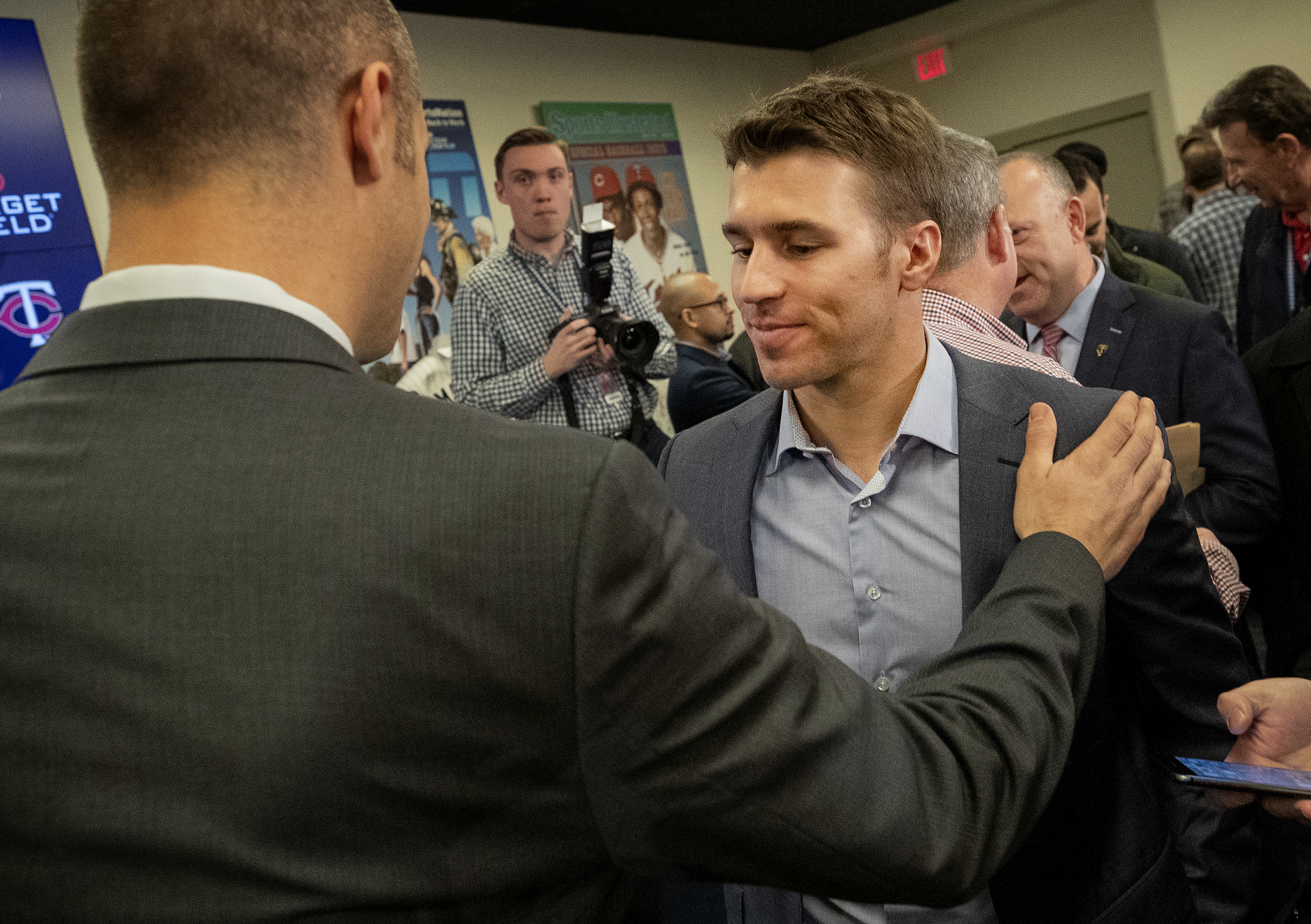 Joe Mauer was greeted by the Wild's Zach Parise after his retirement news conference at Target Field.