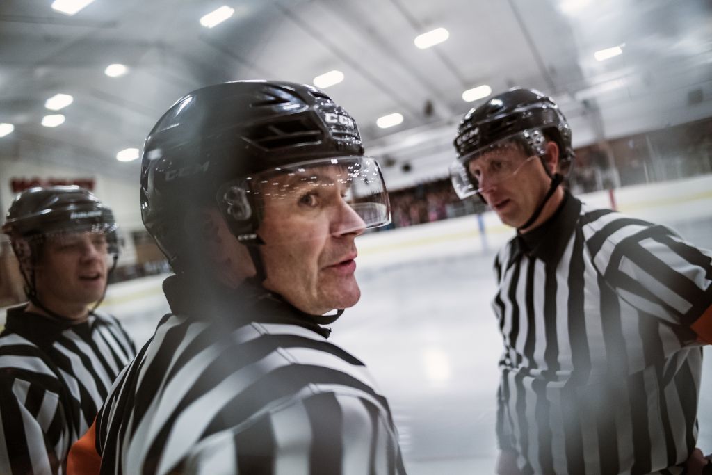 C.J. Beaurline, center, has over 20 years of experience as an official. On the left is linesman David Berthiaume and on the far right is Joe Harris.