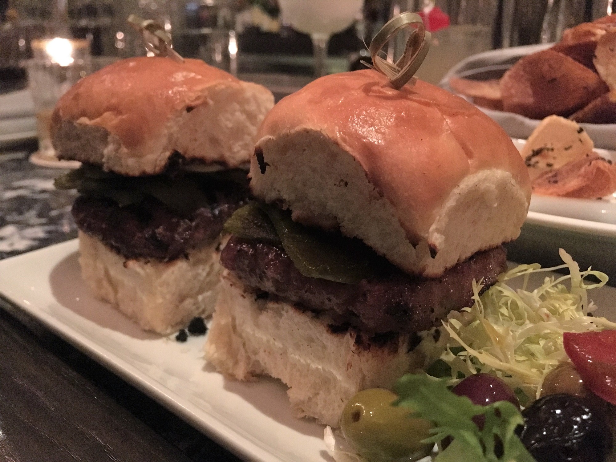 The lamb burgers at P.S. Steak pay tribute to those from La Belle Vie.