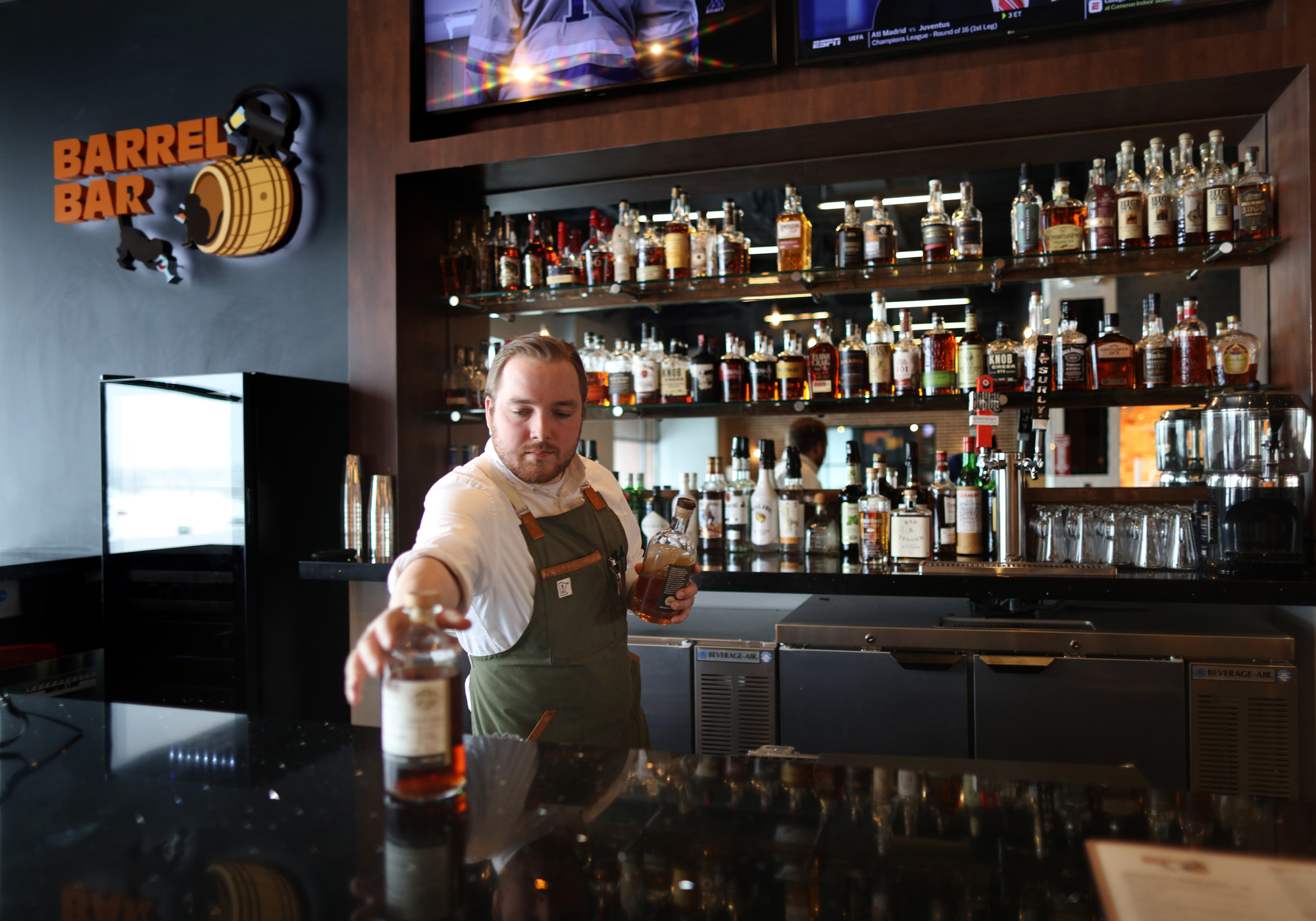 Joseph McGrath tends the Barrel Bar with its extensive whiskey offerings, including several from Minnesota.