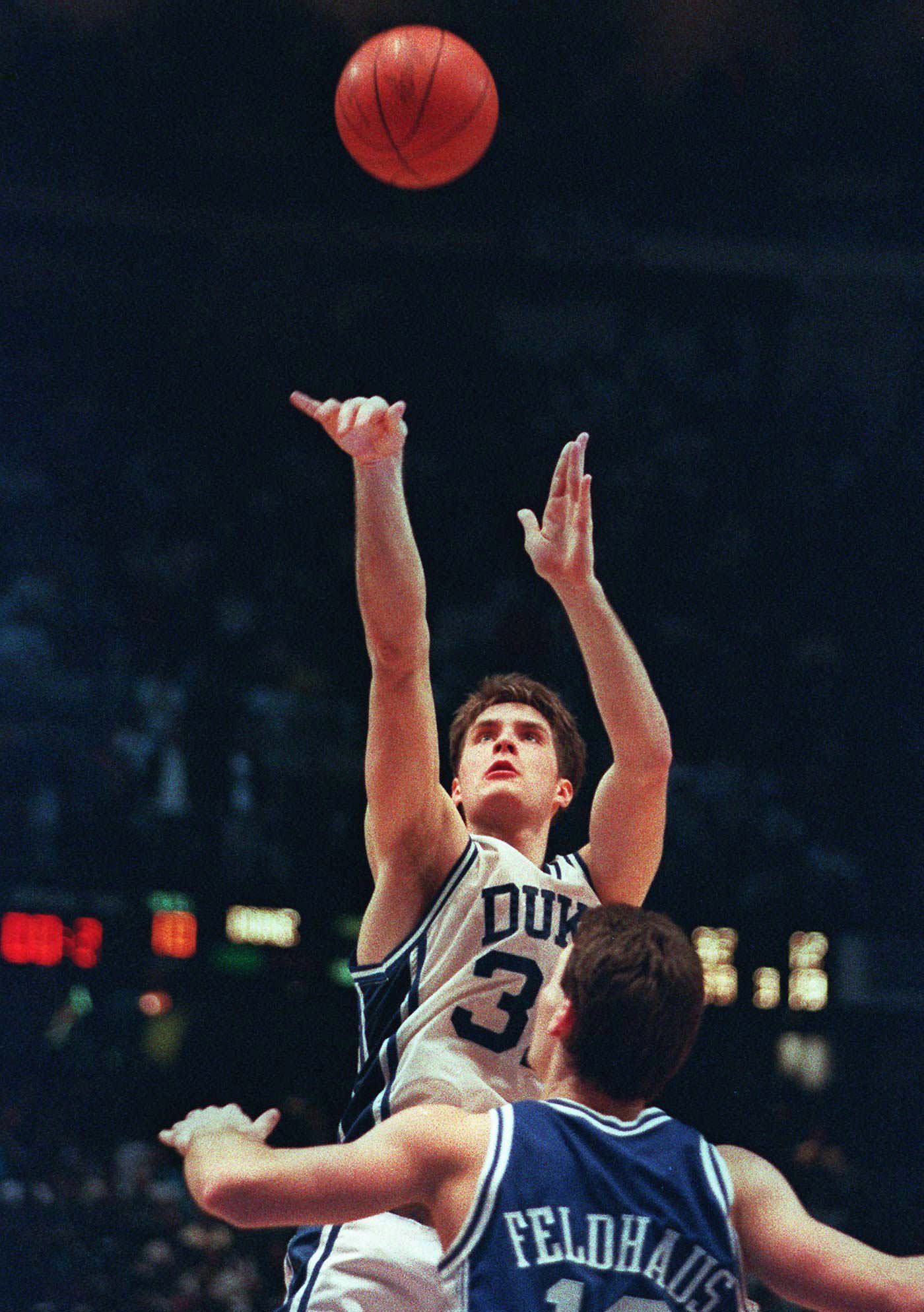 Duke's Christian Laettner shoots the game-winning basket in overtime over Kentucky's Deron Feldhaus
