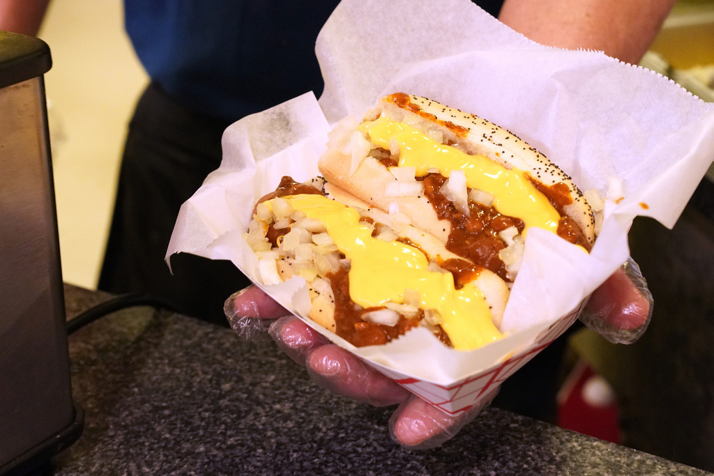 Dave Maguson served up a pair of chili cheese dogs at Walkin' Dog.