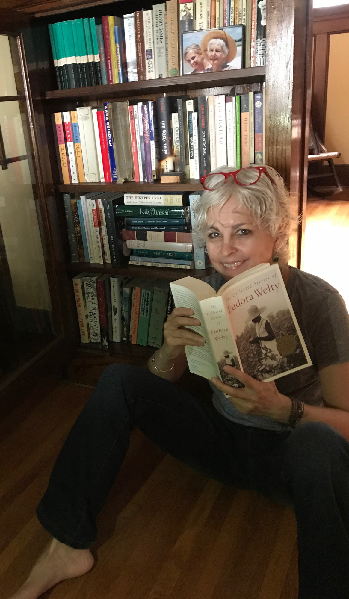 Kate DiCamillo and one of her many bookcases.