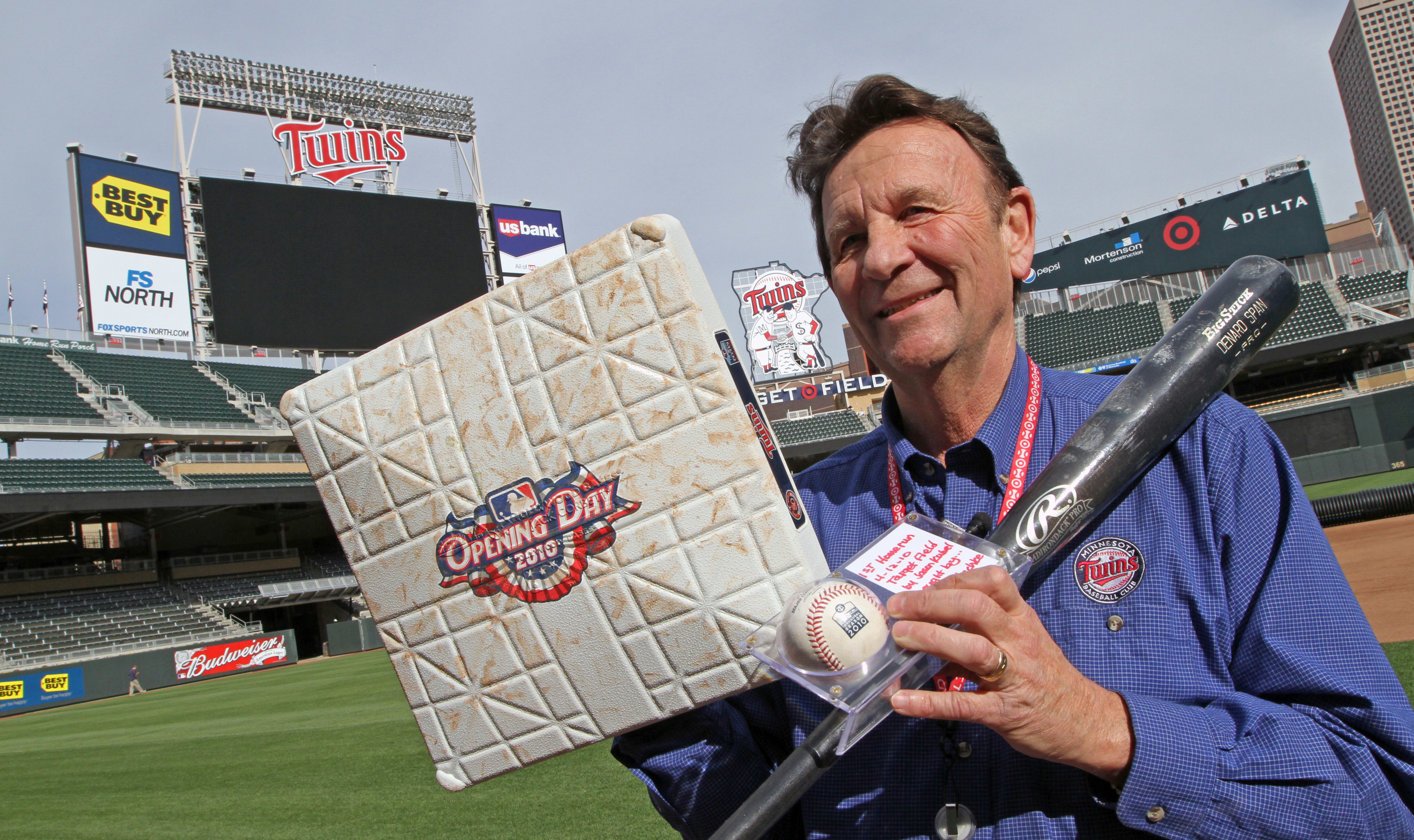 Twins Team Curator Clyde Doepner held first base from the Twins opener in 2010, the ball hit by Jason Kubel for the first regular season home run and the bat used by Denard Span to hit a home run