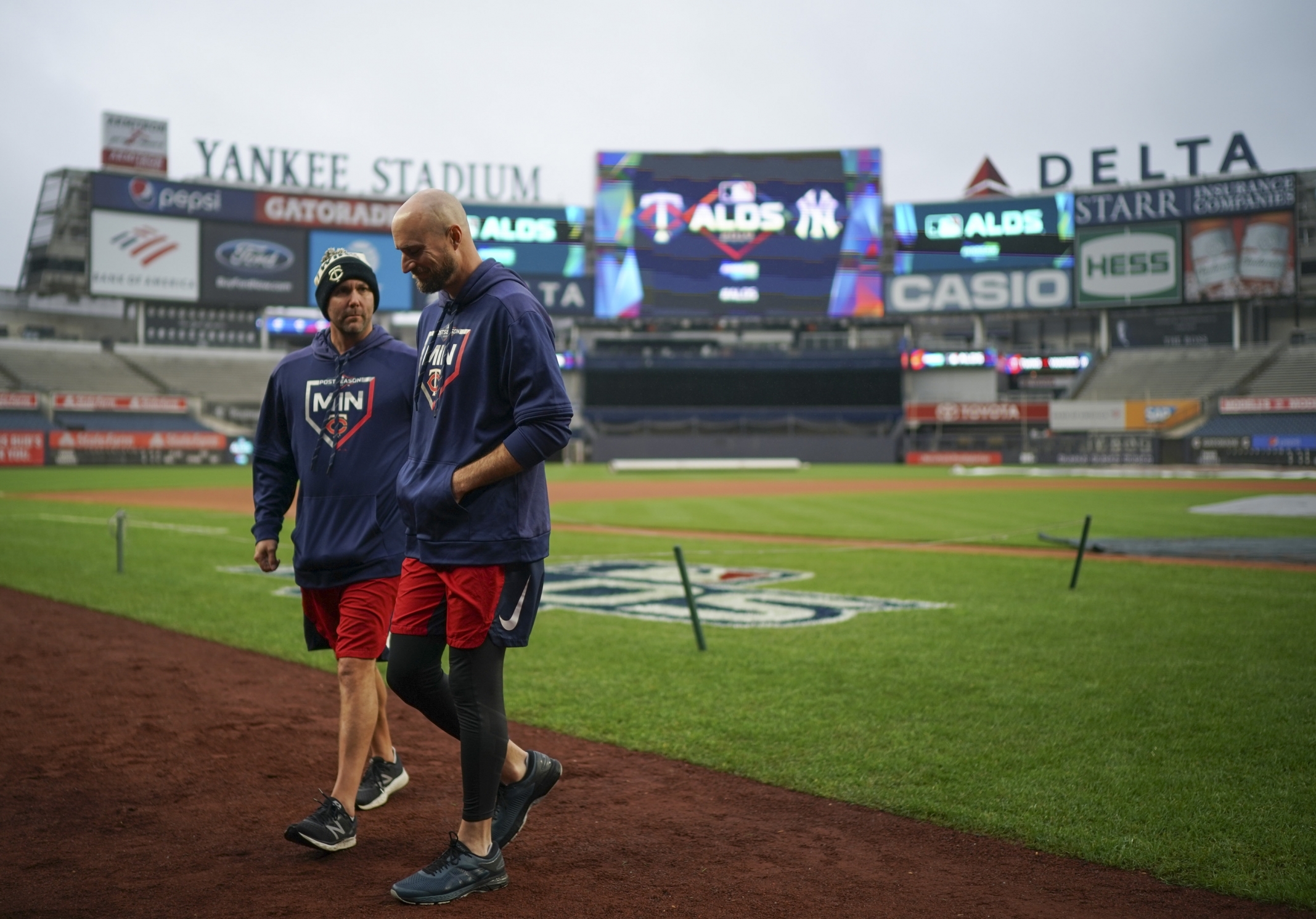 Baldelli, right, walked off the field at Yankee Stadium after watching a few players work out Thursday.