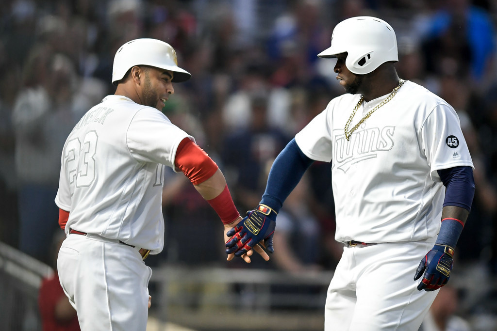 Miguel Sano and Cruz congratulated each other after a home run vs. Detroit in August.