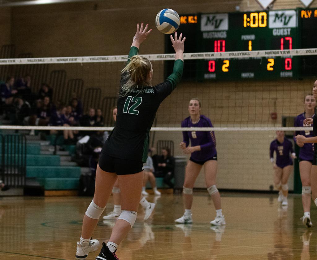 Mounds View junior Shannon Cummings made a tip at the net against Cretin Derham-Hall shot on Tuesday. The Raiders beat the Mustangs in three sets. Pho