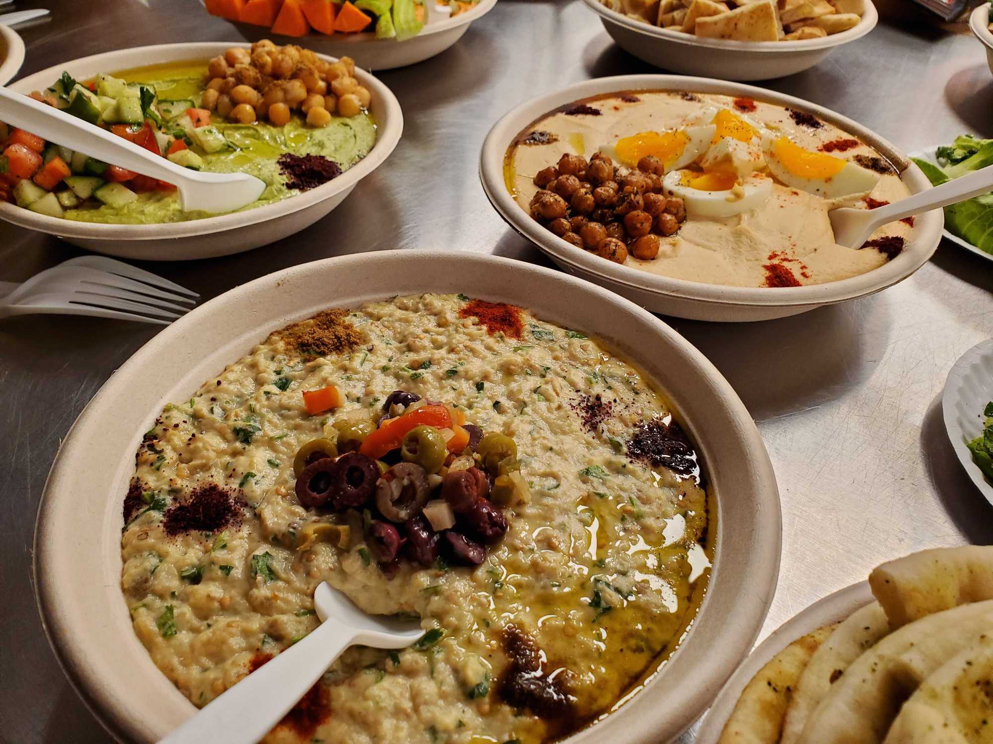 Baba ganoush and hummus from Chickpea, a build-your-own hummus bar at Potluck, Rosedale Center's new food hall