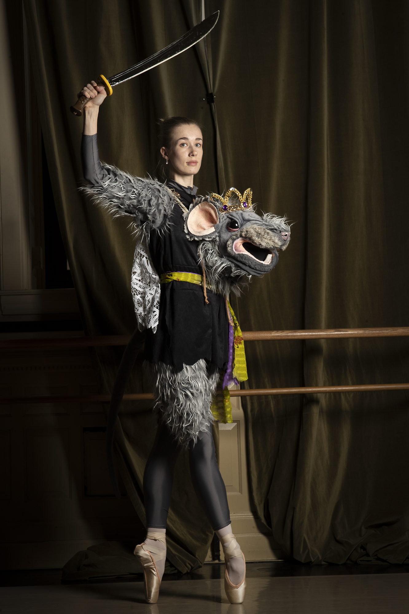 Emily Kleinschmidt wears a giant mask as the Mouse Queen in Twin Cities Ballet's 