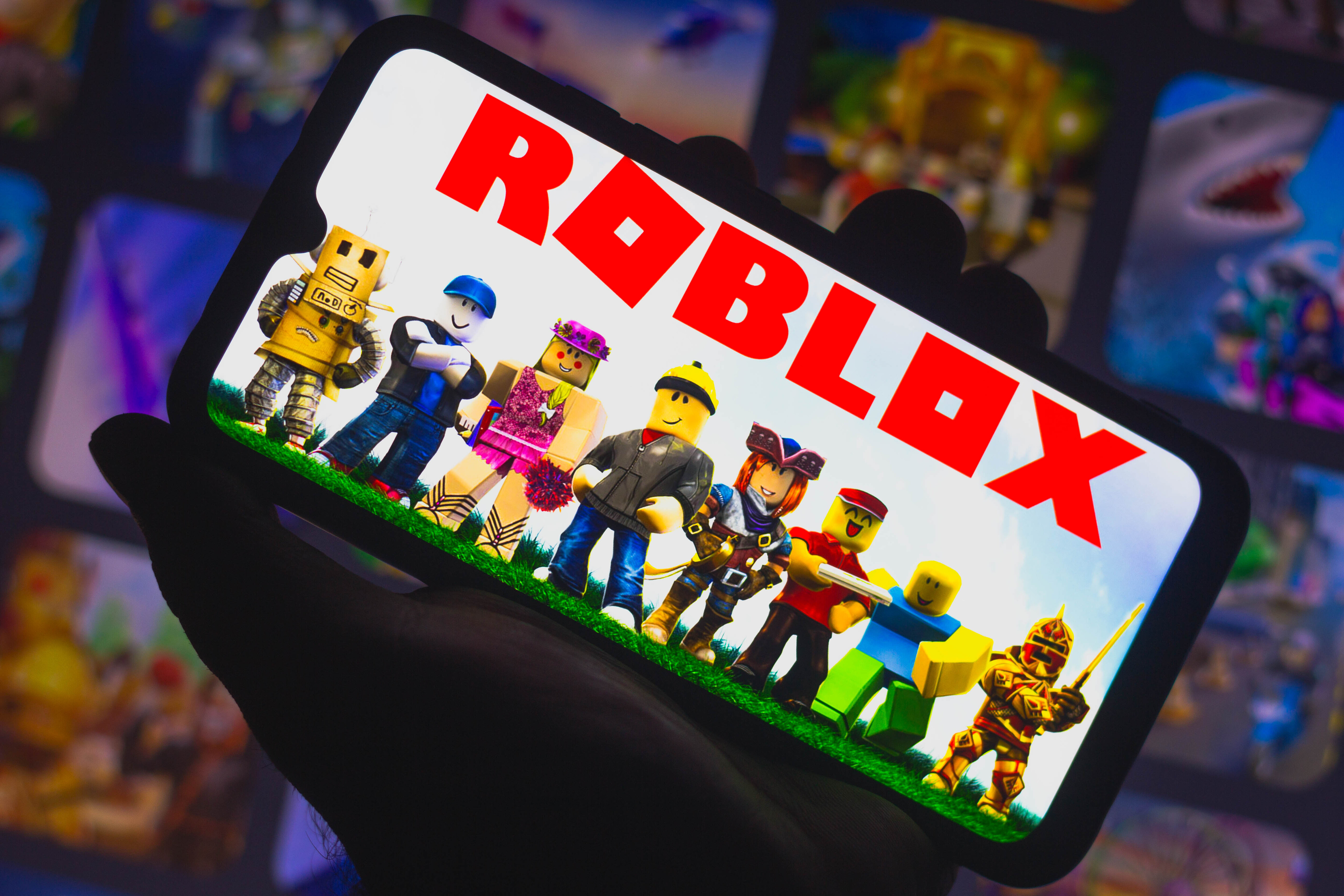 In this photo illustration Roblox logo seen displayed on a...