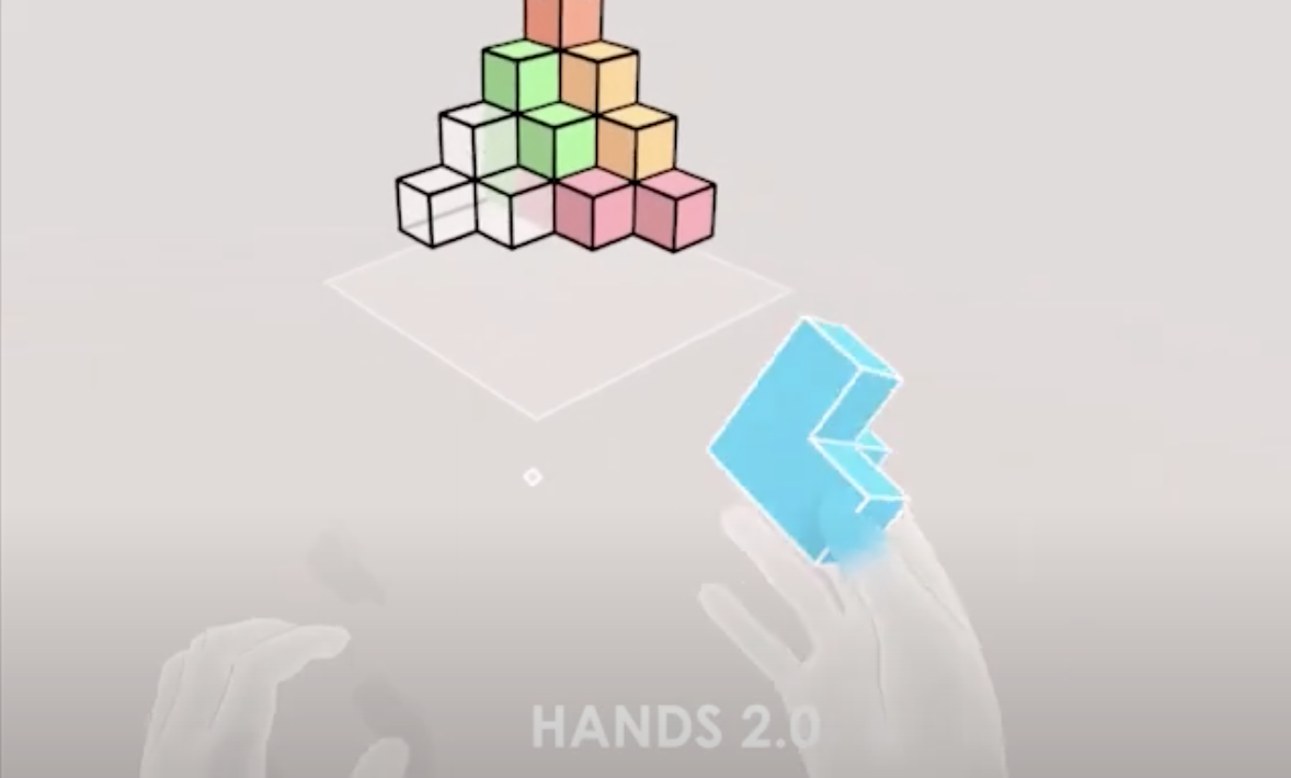 A virtual hand manipulating a cube