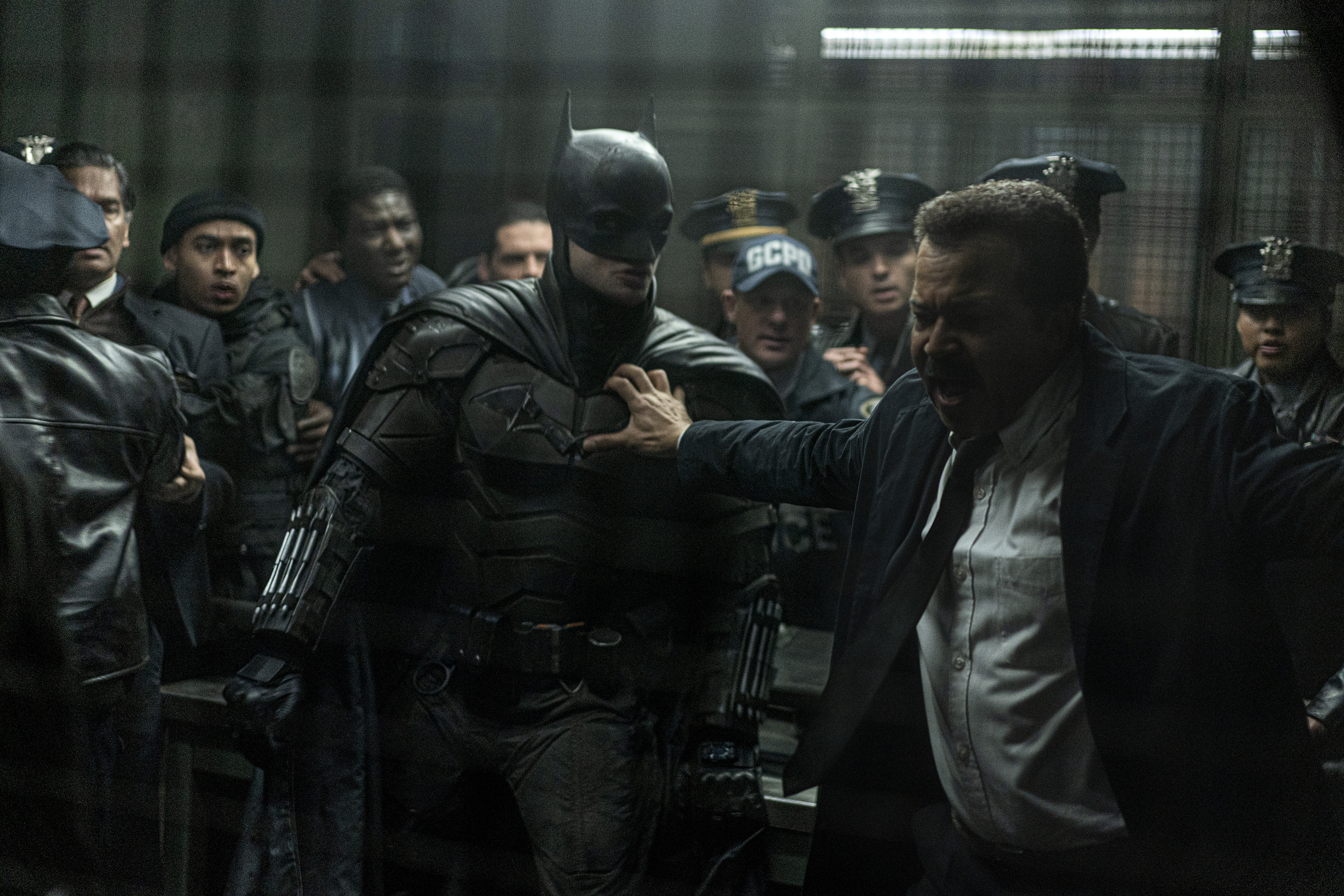 Batman, Jim Gordon, and multiple Gotham cops all about to brawl with one another.