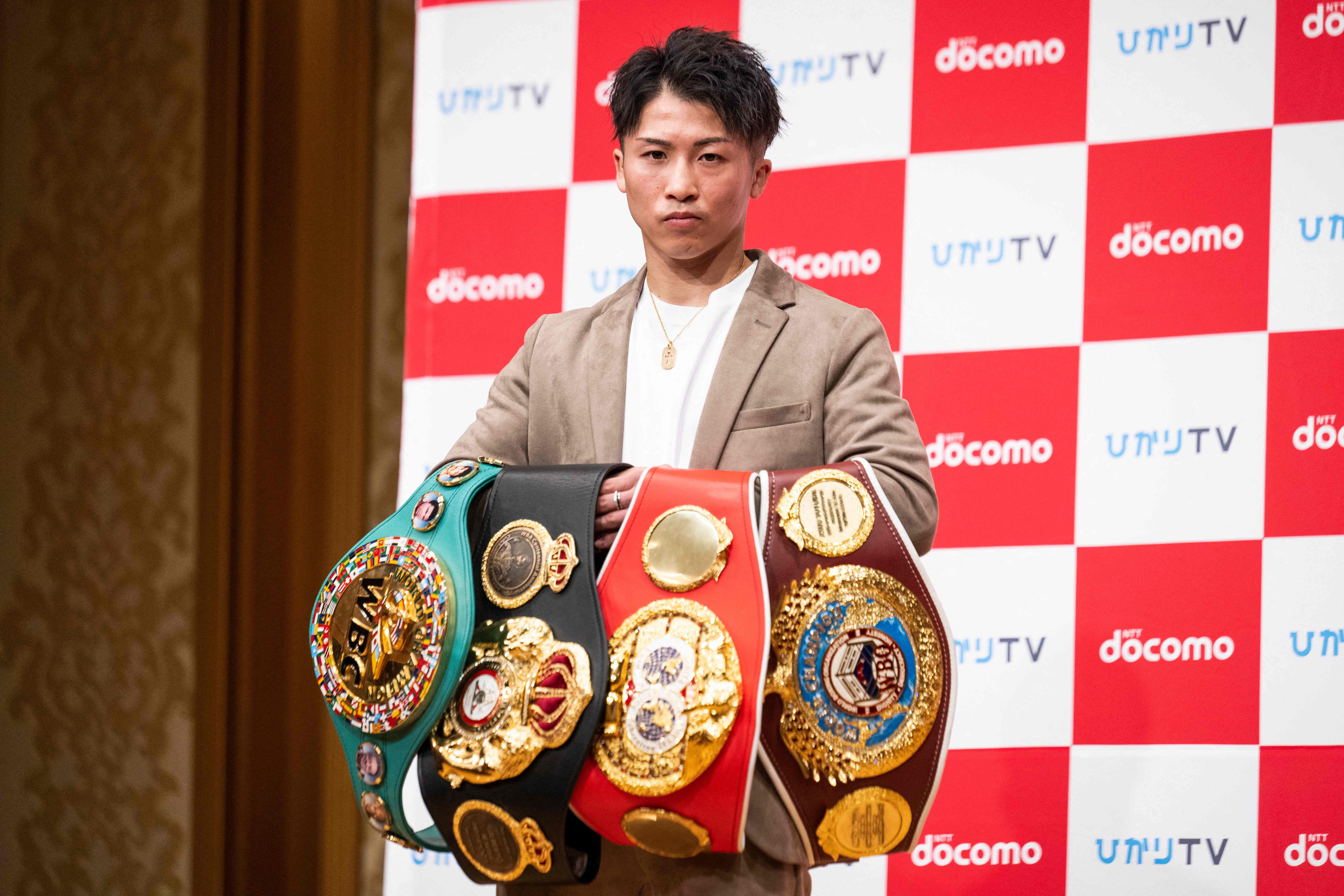 Naoya Inoue poses with his major world titles as he looks to take on more challenges in a new division.