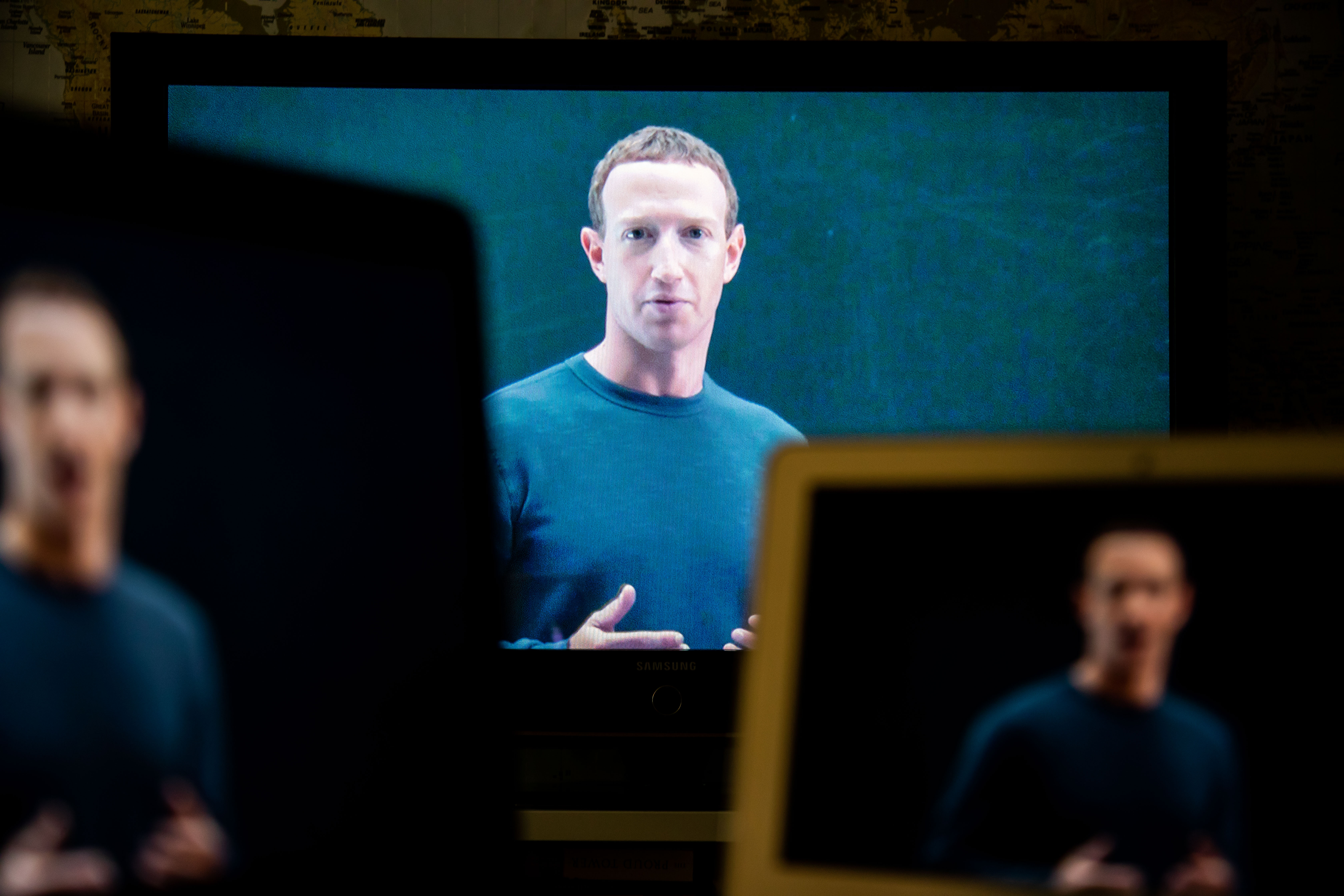 Mark Zuckerberg on multiple screens.