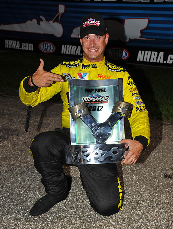 Spencer Massey shows off the trophy from his $100,000 victory in the Traxxas Nitro Shootout for the Top Fuel class during the Mac Tools U.S. Nationals at Indianapolis. (Photo by Ron Lewis)