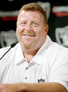 Tom Cable:  The fat smiling face of an alleged woman beater.