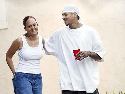 The Iverson's in happier times.  For the Iverson's happier times included oversized white t's, solo cups, and neck grabs.