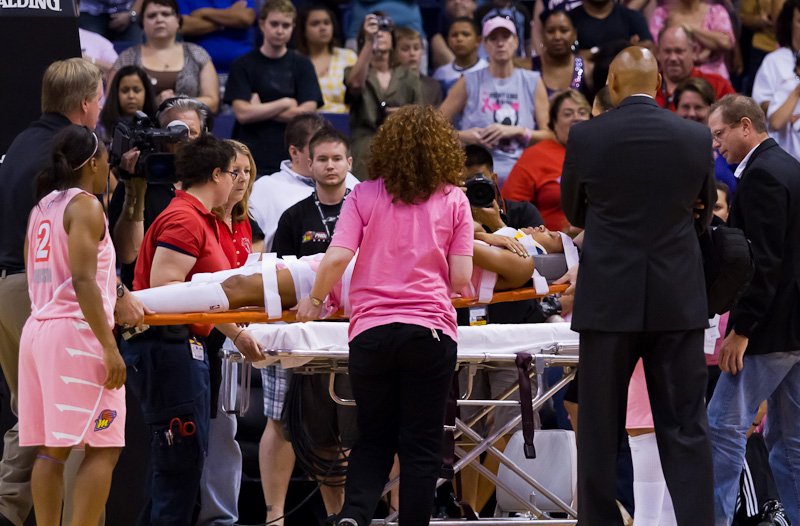 DeWanna Bonner taken off the court on a stretcher. (Photo by Ryan Malone).
