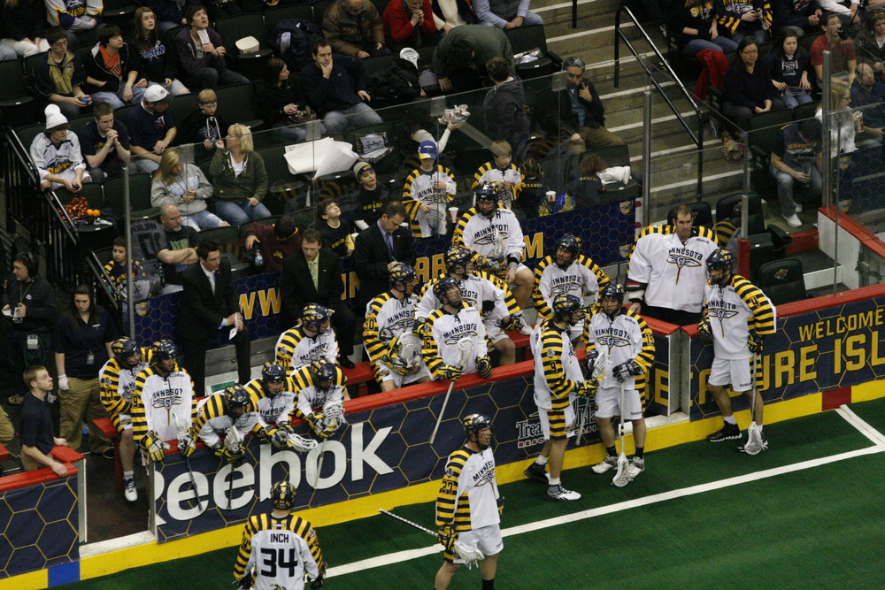 The Minnesota Swarm wait for the third quarter to start in their 12-9 loss to the Bandits. Photo Credit: Todd Foell, Todd James Photography.