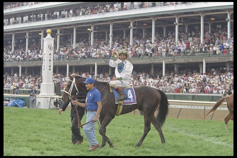  May 1996: Jerry Bailey on Grindstone waves to the crowds as a handler leads the horse off the track after winning the Kentucky Derby at Churchill Downs in Louisville, Kentucky. Mandatory Credit: Simon Bruty /Allsport Date created:	