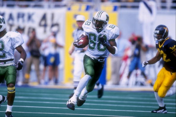 30 Aug 1997: Wide receiver Randy Moss #88 of the Marshall Thundering Herd carries to football during the Thundering Herd 42-31 loss to the West Virginia Moutaineers at Mountaineer Field in Morgantown, West Virginia. (Rick Stewart /Allsport)