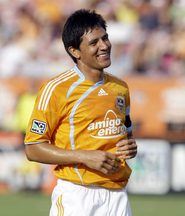 Looks like former Houston Dynamo Brian Ching won't be retiring after all. Ching said that he'll report to the Montreal Impact. (Photo by Bob Levey/Getty Images)