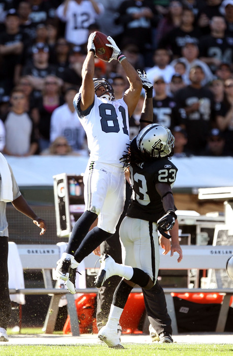 OAKLAND CA - OCTOBER 31:  Golden Tate #81 of the Seattle Seahawks makes a leaping catch over Jeremy Ware #23 of the Oakland Raiders at Oakland-Alameda County Coliseum on October 31 2010 in Oakland California.  (Photo by Ezra Shaw/Getty Images)