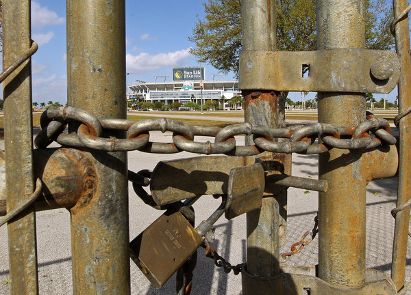 MIAMI GARDENS, FL - MARCH 03:  A view of Sun Life Stadium behind a locked gate as the NFL lockout looms on March 3, 2011 in Miami Gardens, Florida.  (Photo by Mike Ehrmann/Getty Images)