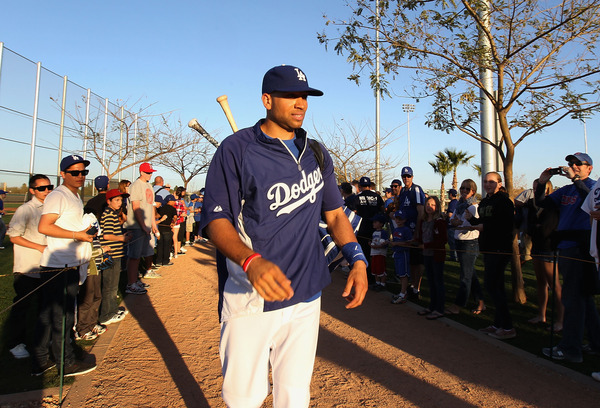 GLENDALE, AZ - MARCH 04: James Loney #7 of the Los Angeles Dodgers walks past fans before the spring training game against the San Francisco Giants at Camelback Ranch on March 4, 2011 in Glendale, Arizona.  (Photo by Christian Petersen/Getty Images)