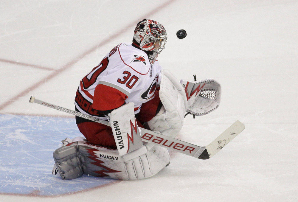 WASHINGTON, DC - MARCH 29:  Goalie Cam Ward #30 of the Carolina Hurricanes blocks a shot on goal during a shootout 3-2 win against the Washington Capitals at the Verizon Center on March 29, 2011 in Washington, DC. (Photo by Rob Carr/Getty Images)