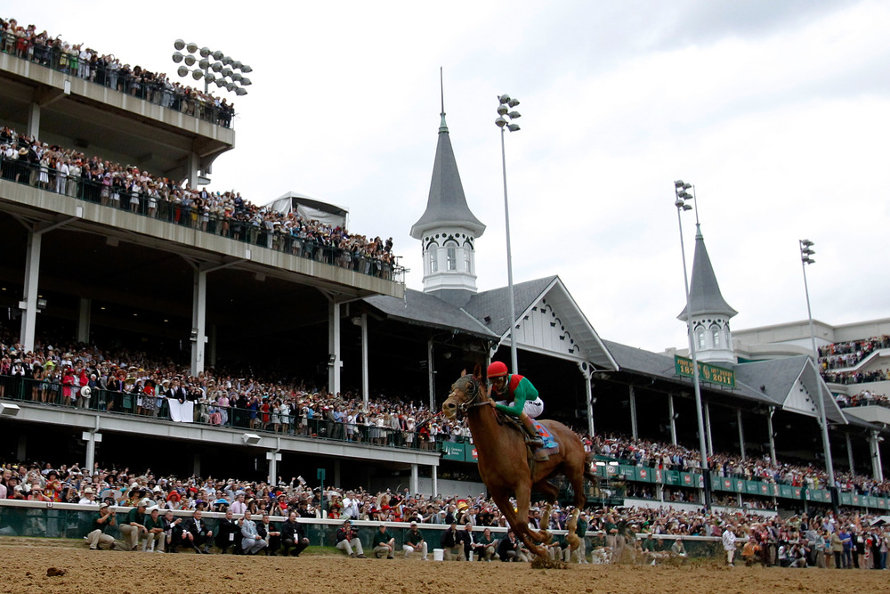LOUISVILLE, KY - MAY 07:  Jockey John Velazquez, riding Animal Kingdom #16 crosses the finish line on way to winning the 137th Kentucky Derby at Churchill Downs on May 7, 2011 in Louisville, Kentucky.  (Photo by Rob Carr/Getty Images)