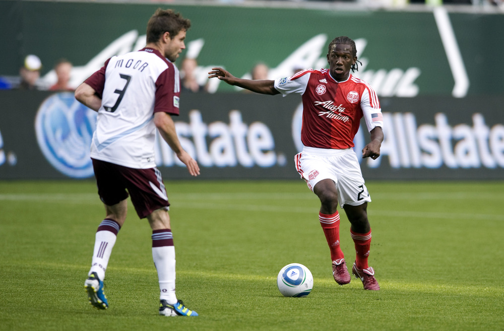 PORTLAND, OR - JUNE 11: Diego Chara #21 of the Portland Timbers drives on Drew Moor #3 of the Colorado Rapids during the first half of the game at Jeld-Wen Field on June 11, 2011 in Portland, Oregon. (Photo by Steve Dykes/Getty Images)