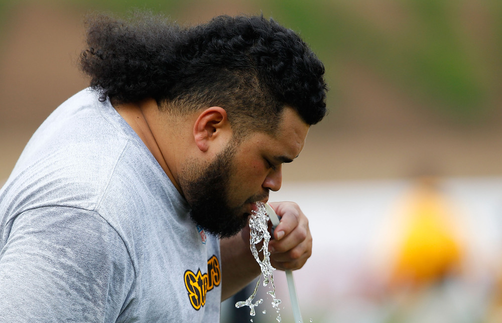 LATROBE, PA - JULY 29:  Chris Kemoeatu #68 of the Pittsburgh Steelers, currently on the PUP list, takes a drink of water during training camp on July 29, 2011 at St Vincent College in Latrobe, Pennsylvania.  (Photo by Jared Wickerham/Getty Images)