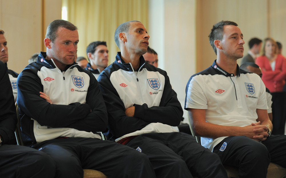 ST ALBANS, ENGLAND - AUGUST 09:  (L-R) Wayne Rooney, Rio Ferdinand and John Terry look on during the England press conference at The Grove Hotel on August 9, 2011 in Watford, England.  (Photo by Michael Regan/Getty Images)