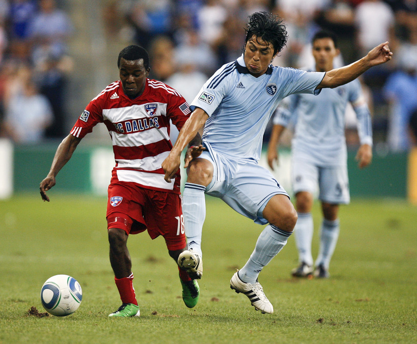 KANSAS CITY, KS - AUGUST 27:  Marvin Chavez of FC Dallas #18 and Roger Espinoza #15 of Sporting KC compete for the ball in the first half at Livestrong Sporting Park on August 27, 2011 in Kansas City, Kansas. (Photo by Ed Zurga/Getty Images)