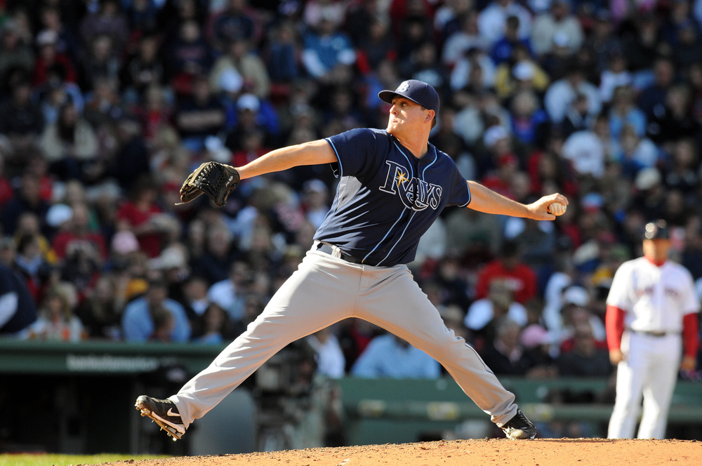 BOSTON, MA - SEPTEMBER 18:  Jake McGee #57 of the Tampa Bay Rays throws a pitch in the fifth inning against the Boston Red Sox at Fenway Park on September 18, 2011 in Boston, Massachusetts.(Photo by Darren McCollester/Getty Images)