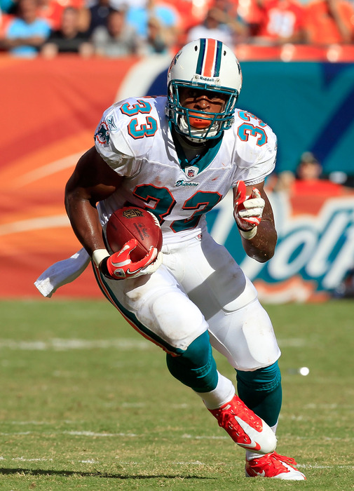 MIAMI GARDENS, FL - SEPTEMBER 18:  Miami Dolphins running back Daniel Thomas #33 runs for yardage during a game against the Houston Texans at Sun Life Stadium on September 18, 2011 in Miami Gardens, Florida.  (Photo by Sam Greenwood/Getty Images)