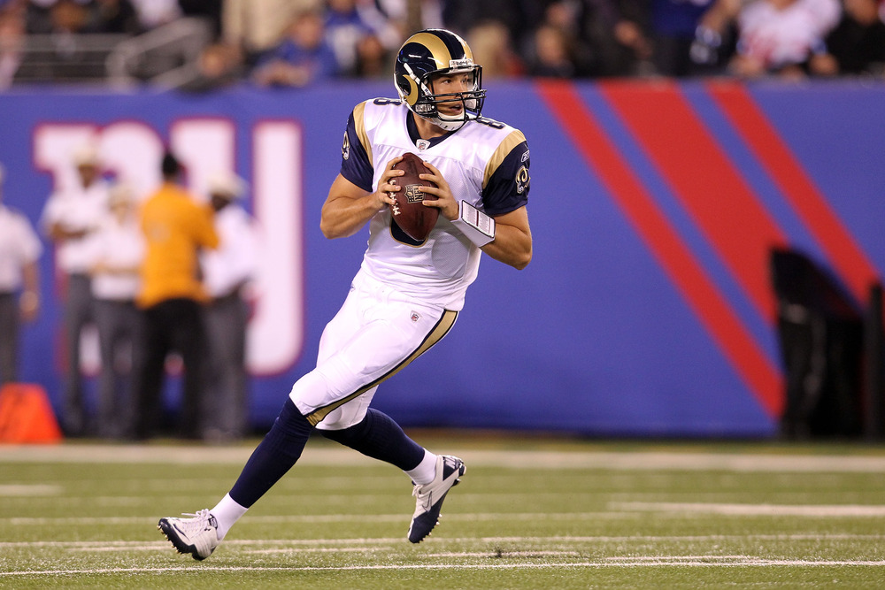 EAST RUTHERFORD, NJ - SEPTEMBER 19:  Sam Bradford #8 of the St. Louis Rams rolls out turnover pass against the New York Giants at MetLife Stadium on September 19, 2011 in East Rutherford, New Jersey.  (Photo by Al Bello/Getty Images)