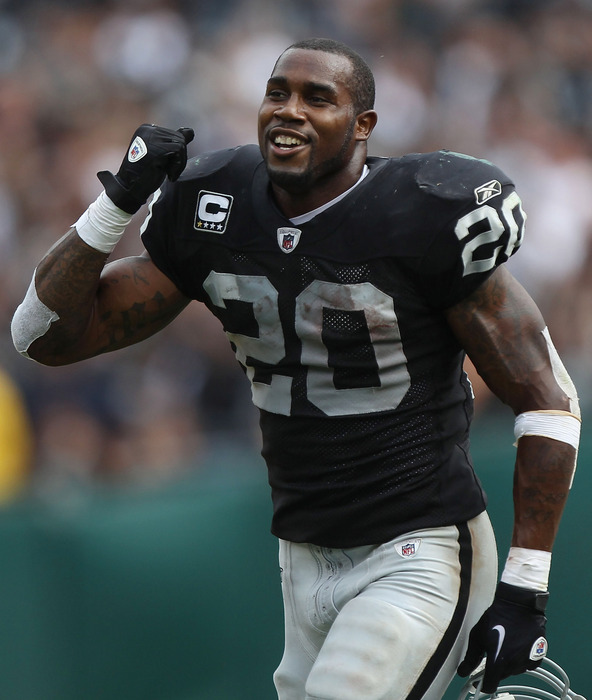 OAKLAND, CA - SEPTEMBER 25:  Darren McFadden #20 of the Oakland Raiders celebrates against the New York Jets at O.co Coliseum on September 25, 2011 in Oakland, California.  (Photo by Jed Jacobsohn/Getty Images)