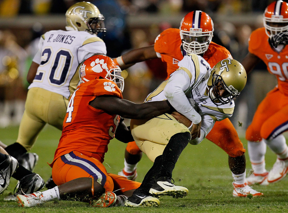ATLANTA, GA - OCTOBER 29:  Rennie Moore #94 of the Clemson Tigers sacks Tevin Washington #13 of the Georgia Tech Yellow Jackets at Bobby Dodd Stadium on October 29, 2011 in Atlanta, Georgia.  (Photo by Kevin C. Cox/Getty Images)