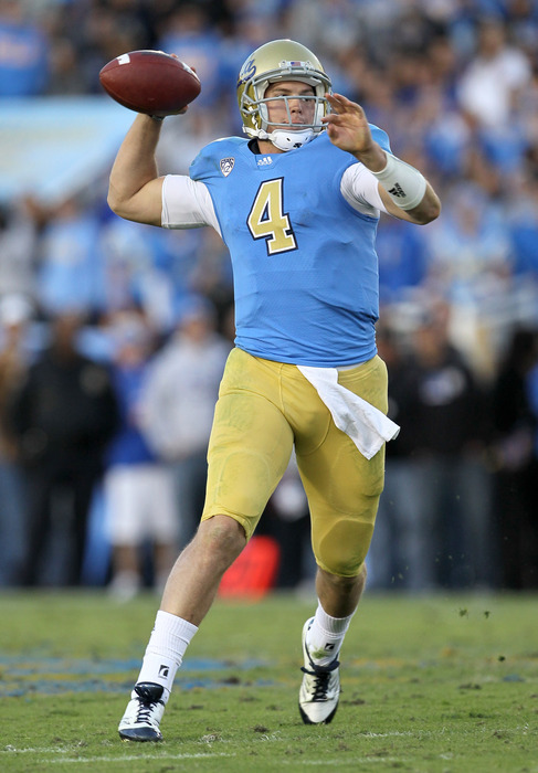 PASADENA, CA - NOVEMBER 05:  Quarterback Kevin Prince #4 of the UCLA Bruins thorws a pass as he scrambles against the Arizona State Sun Devils at the Rose Bowl on November 5, 2011 in Pasadena, California.  (Photo by Stephen Dunn/Getty Images)
